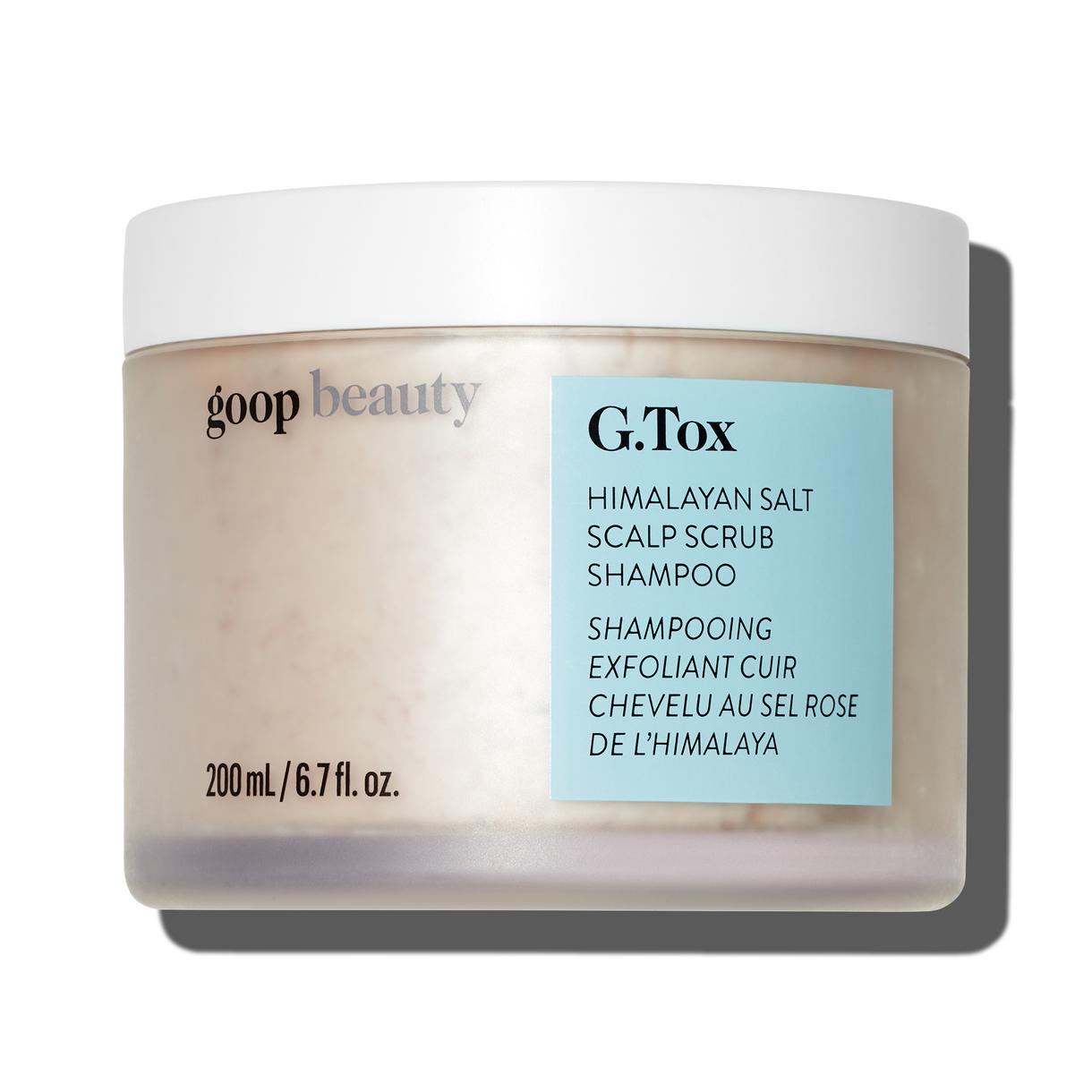 A jar of goop beauty Himalayan Salt Scalp Scrub Shampoo against a white background.
