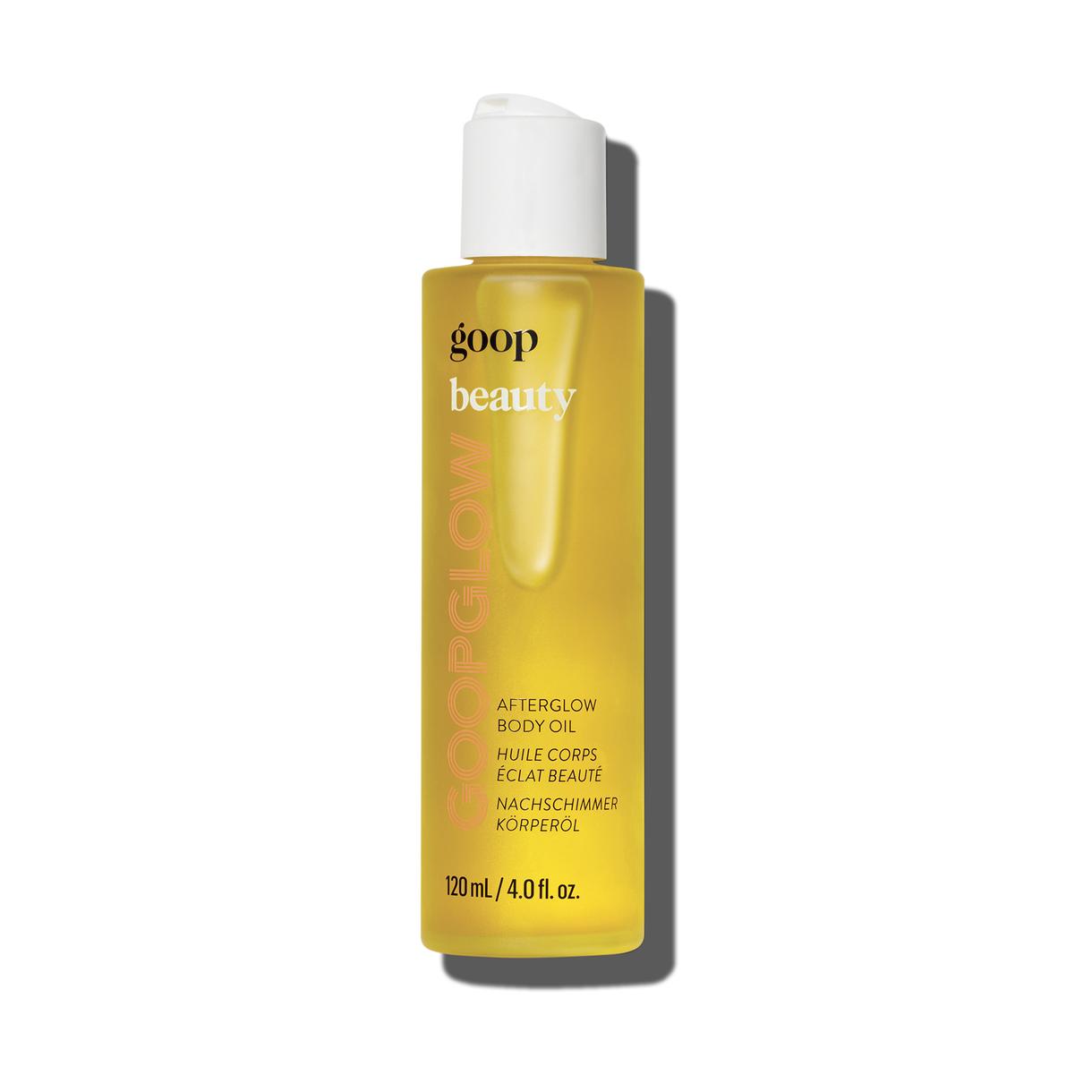 A bottle of goop beauty Afterglow Body Oil positioned upright against a light backdrop.